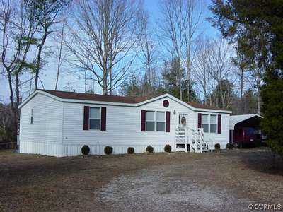 10612 Baltimore Road Ford, VA 23850 - Photo 1 of 1 a front view of a house with a yard