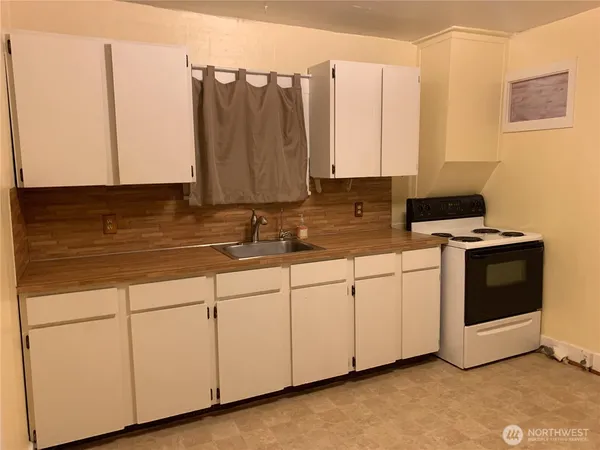 a white refrigerator freezer sitting in a kitchen