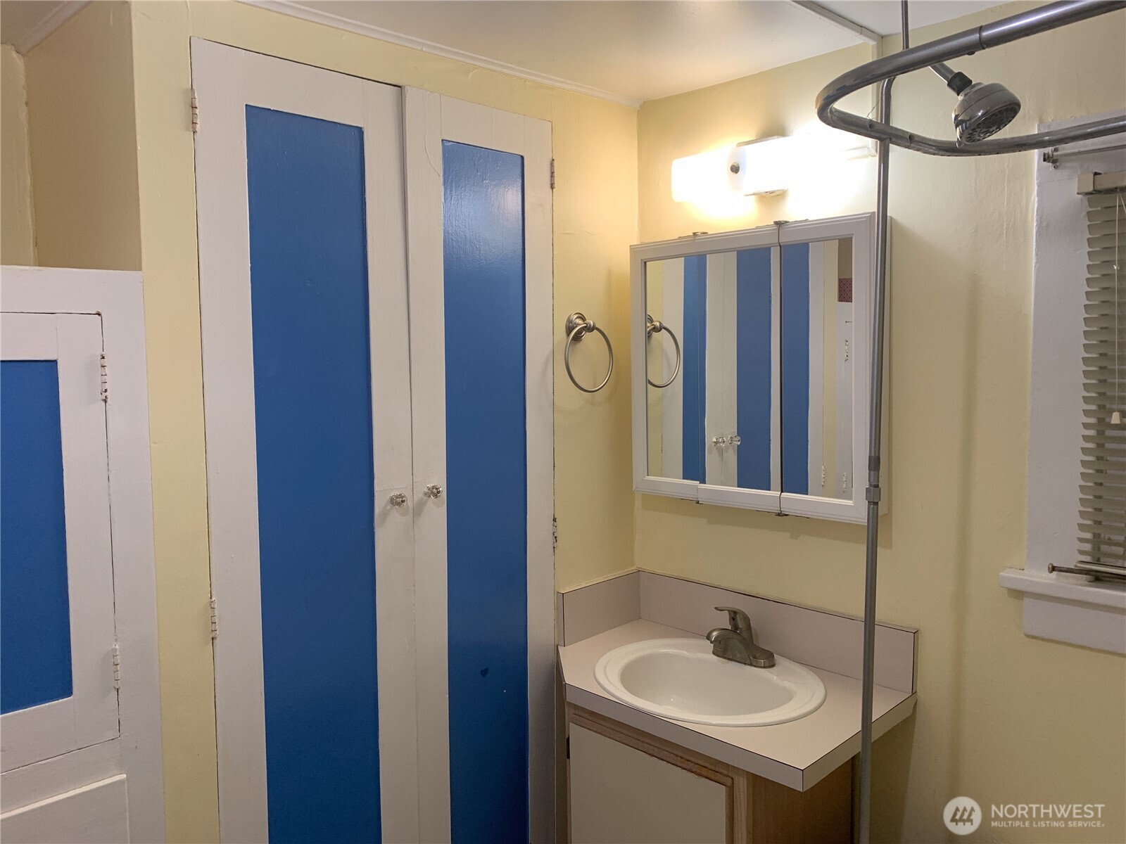 910 Northwest 52nd Street Seattle, WA 98107 - Photo 18 of 22 a bathroom with a sink and mirror