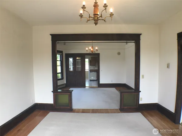 a view of living room with granite countertop furniture and chandelier