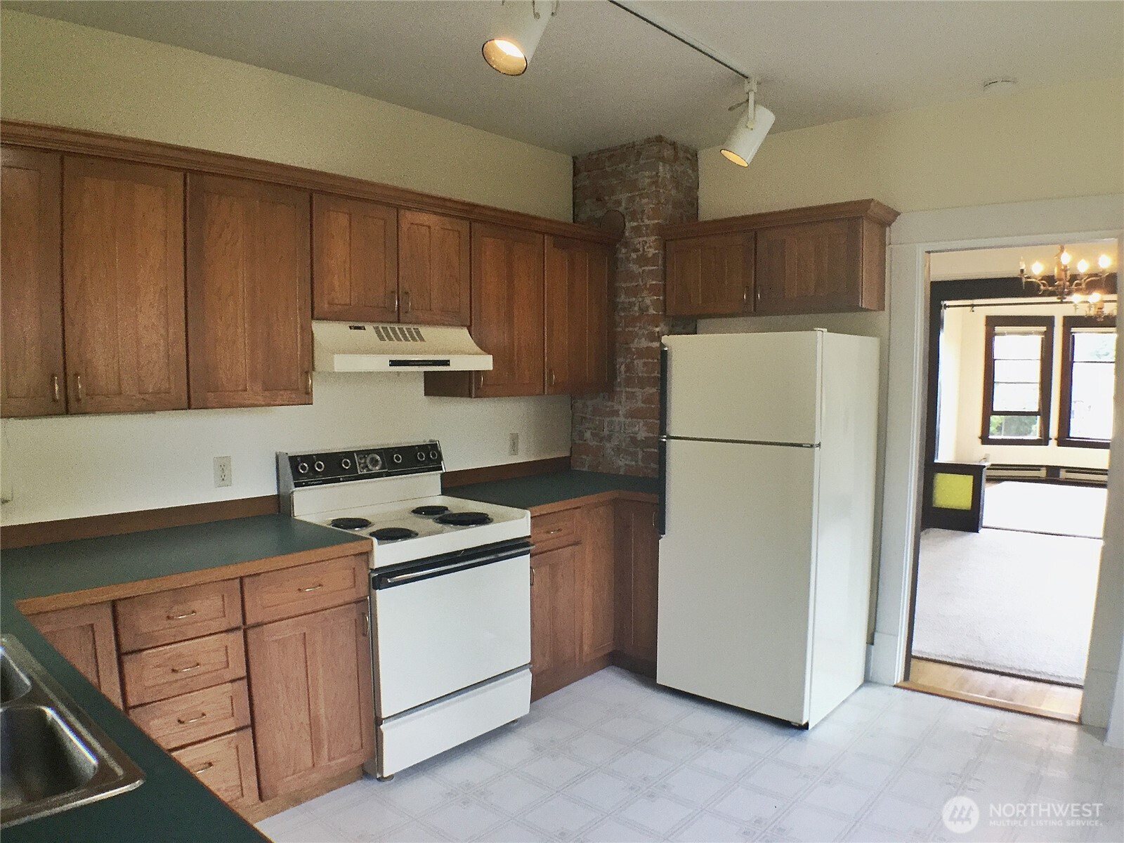 910 Northwest 52nd Street Seattle, WA 98107 - Photo 8 of 22 a kitchen with a white cabinets and refrigerator