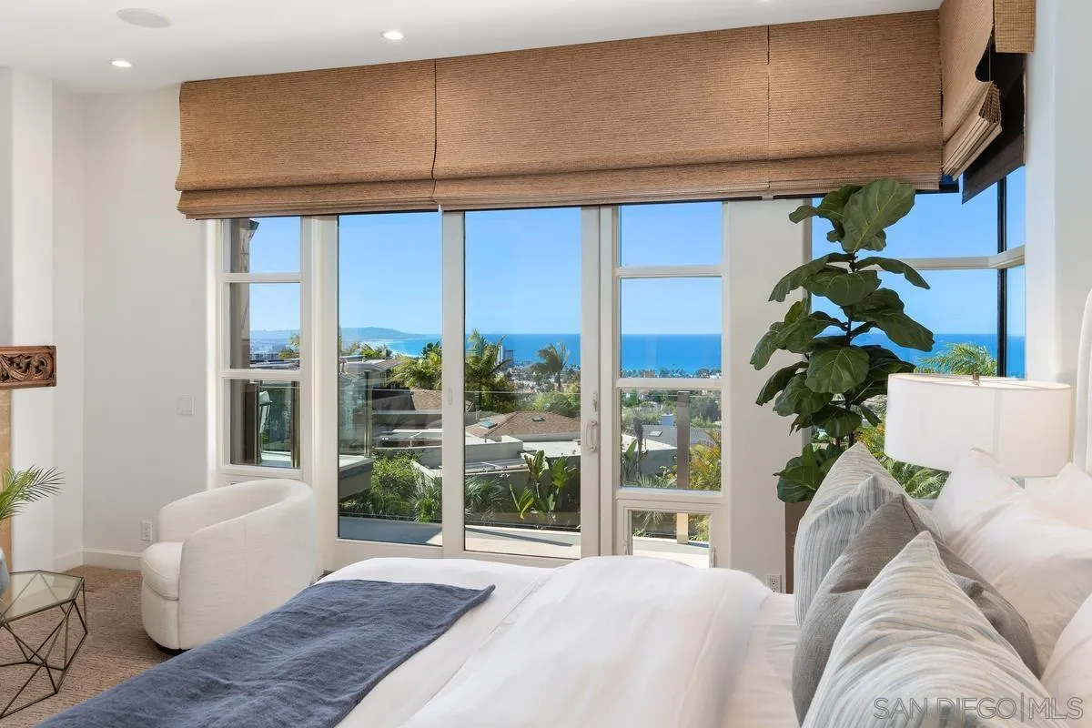 5486 Rutgers Road La Jolla, CA 92037 - Photo 17 of 47 a bed sitting in a bedroom next to a window