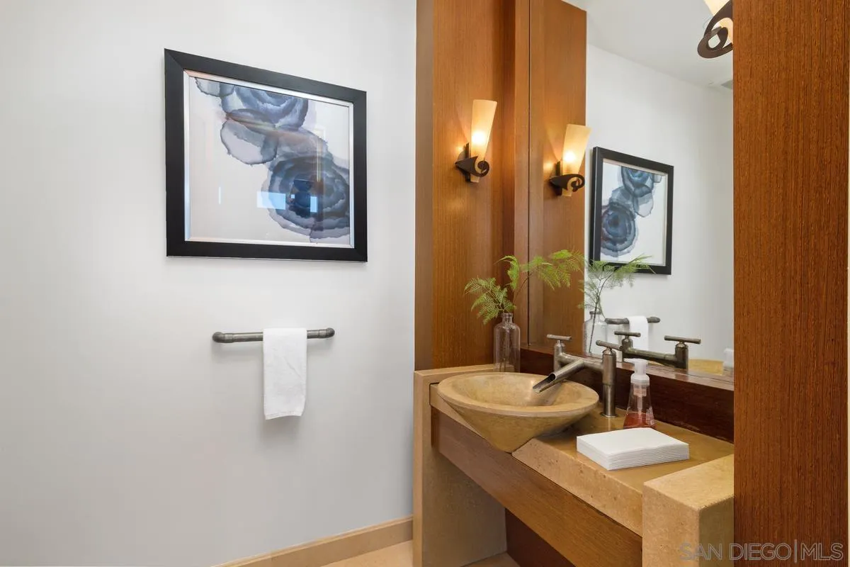 5486 Rutgers Road La Jolla, CA 92037 - Photo 21 of 47 a bathroom with a sink and a mirror