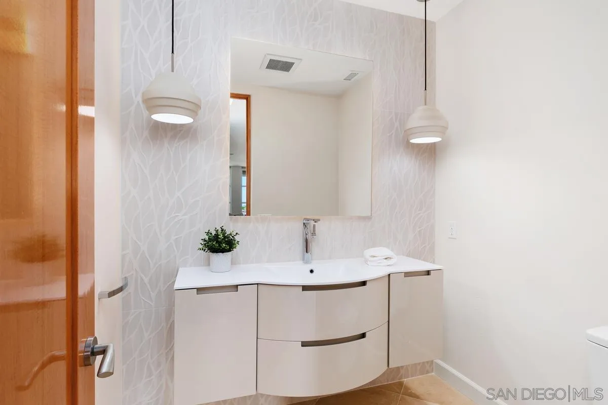5486 Rutgers Road La Jolla, CA 92037 - Photo 28 of 47 a bathroom with a sink and a mirror