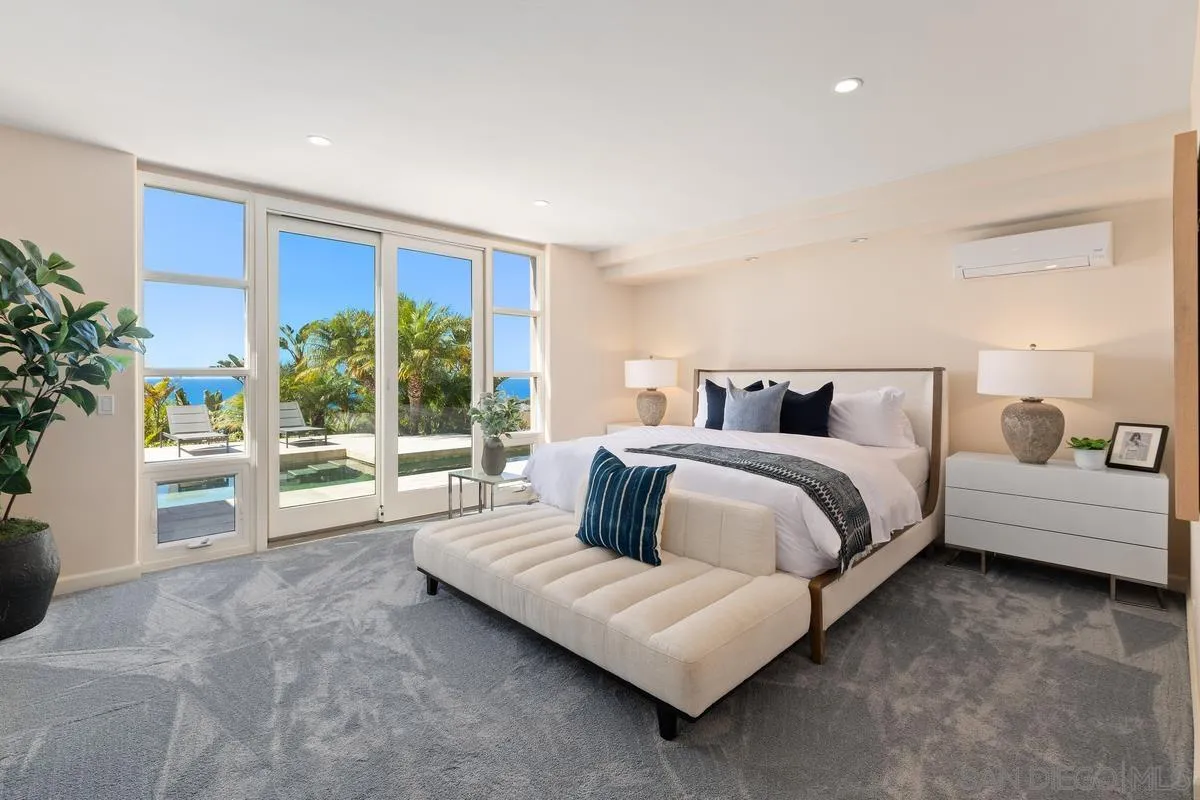 5486 Rutgers Road La Jolla, CA 92037 - Photo 29 of 47 a bedroom with a large bed and a couch