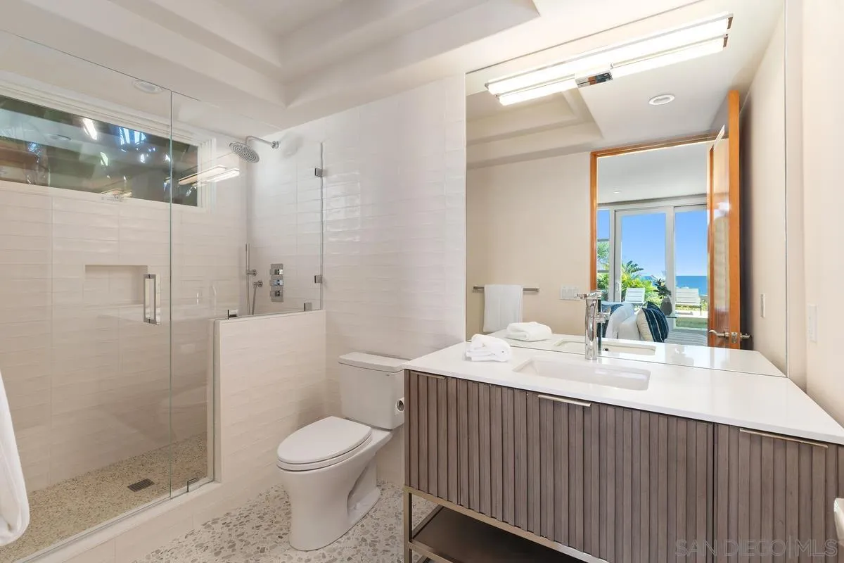 5486 Rutgers Road La Jolla, CA 92037 - Photo 30 of 47 a bathroom with a sink a toilet and shower