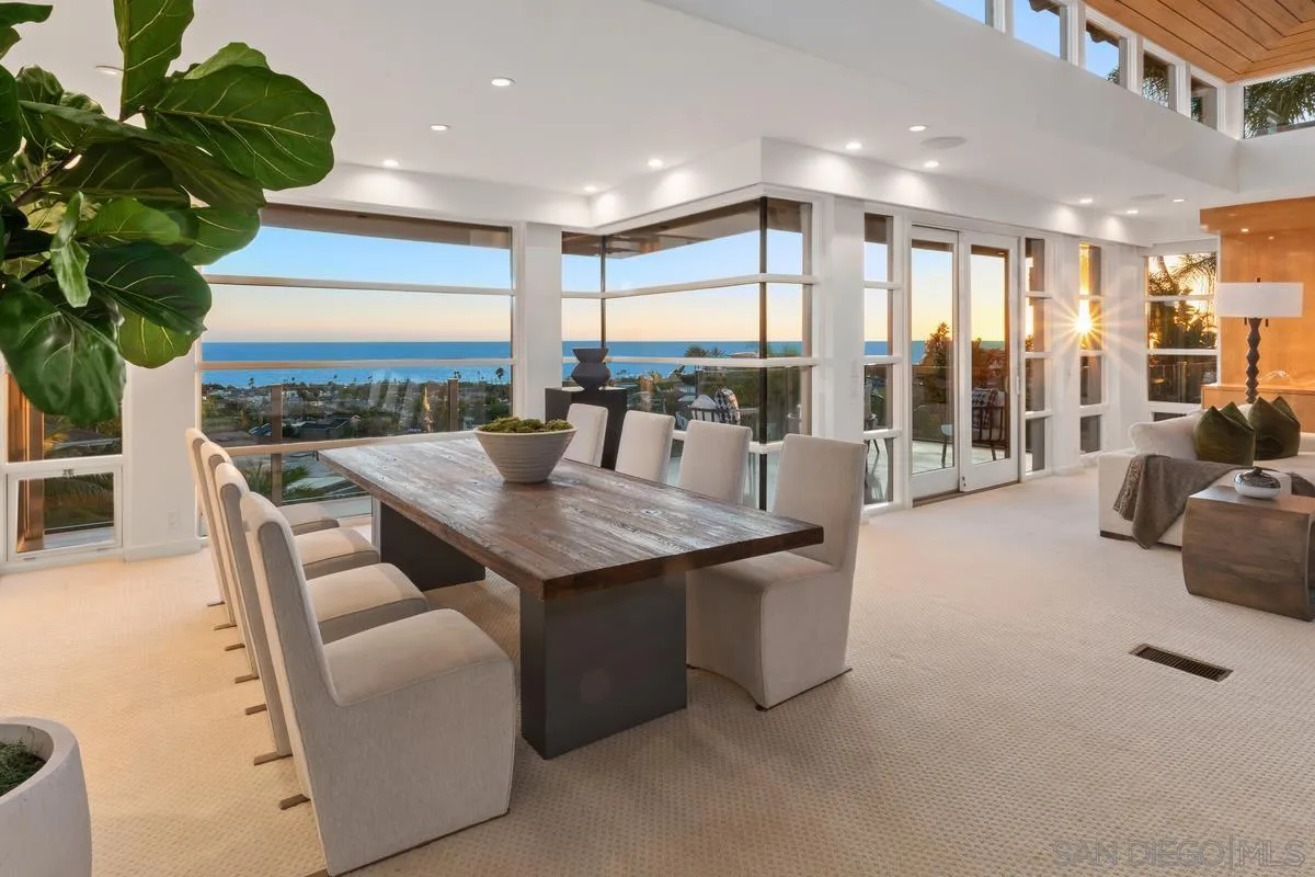 5486 Rutgers Road La Jolla, CA 92037 - Photo 3 of 47 a dining hall with couches a coffee table and chairs with a large window