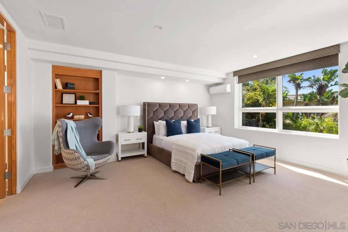 5486 Rutgers Road La Jolla, CA 92037 - Photo 31 of 47 a bedroom with a bed a chair and a large window