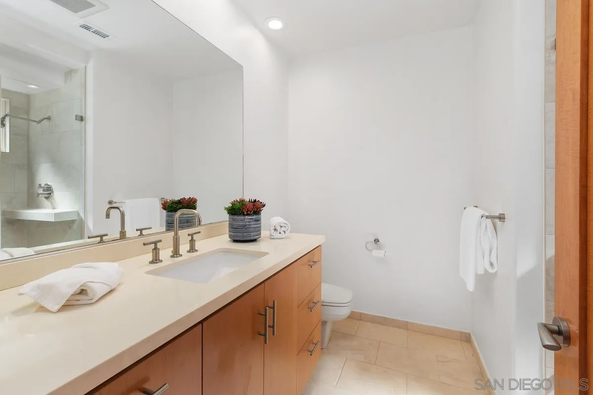 5486 Rutgers Road La Jolla, CA 92037 - Photo 32 of 47 a bathroom with a sink toilet and vanity