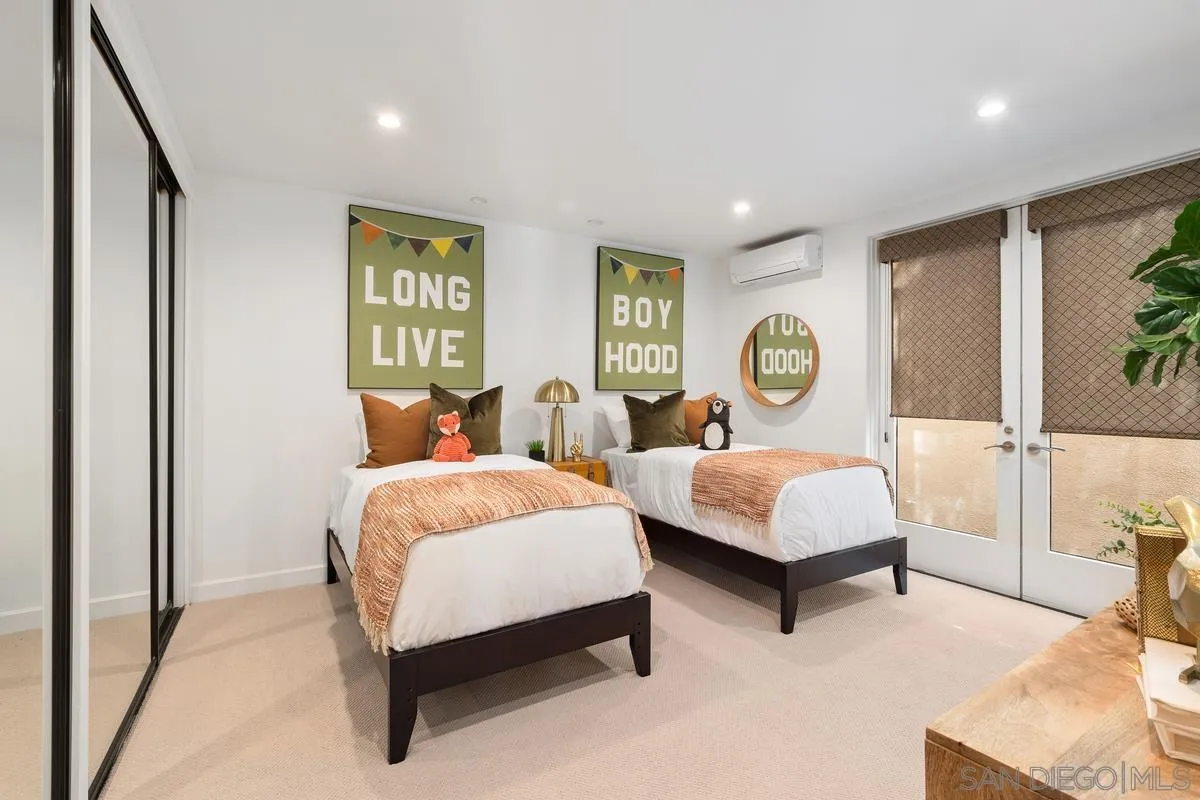 5486 Rutgers Road La Jolla, CA 92037 - Photo 33 of 47 a bedroom with two beds and painting on the wall