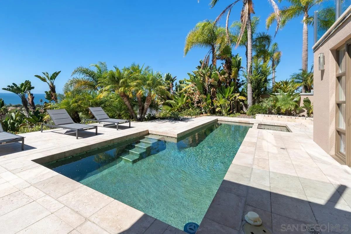 5486 Rutgers Road La Jolla, CA 92037 - Photo 37 of 47 a view of a swimming pool with a yard