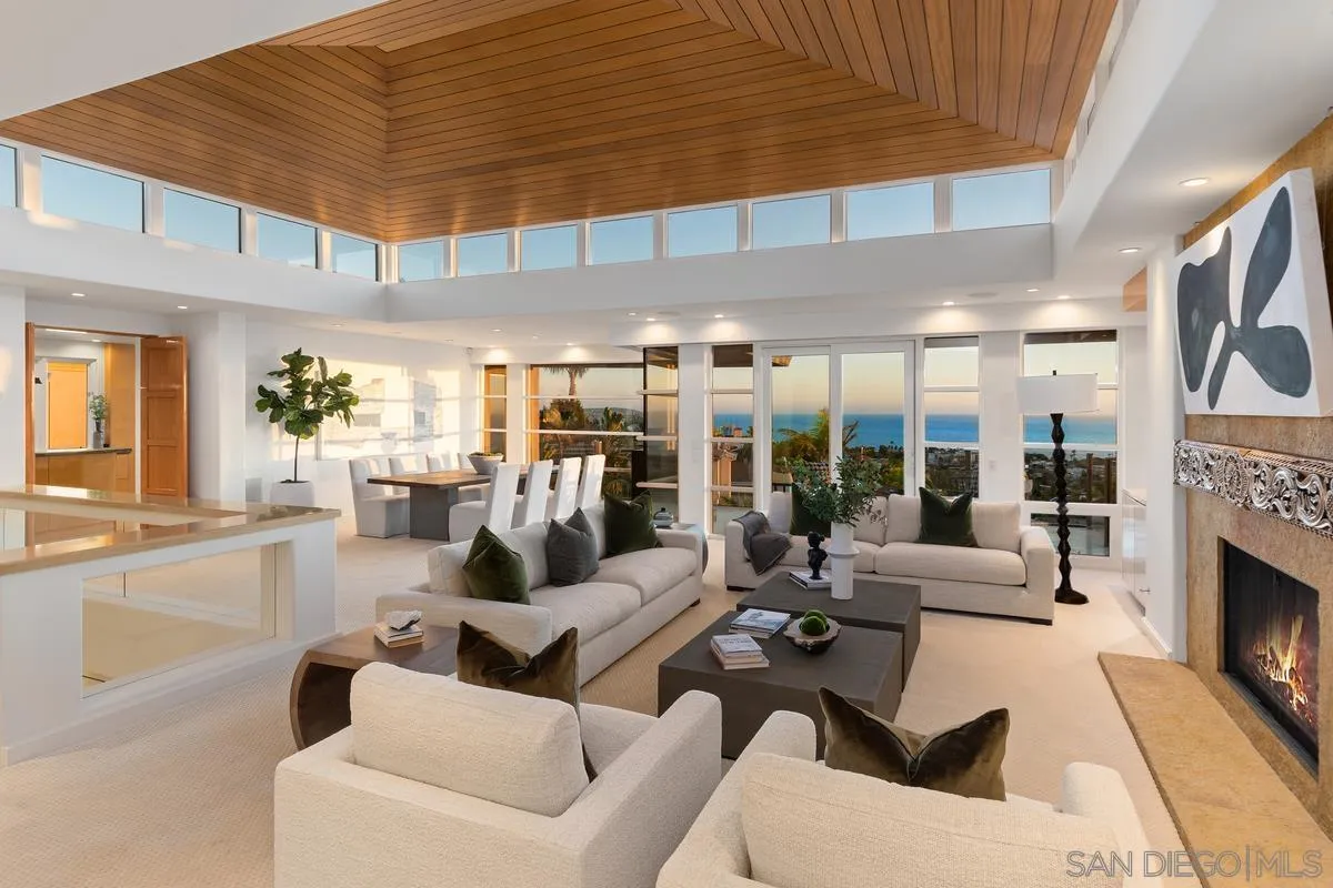 5486 Rutgers Road La Jolla, CA 92037 - Photo 44 of 47 a living room with furniture fireplace and large windows