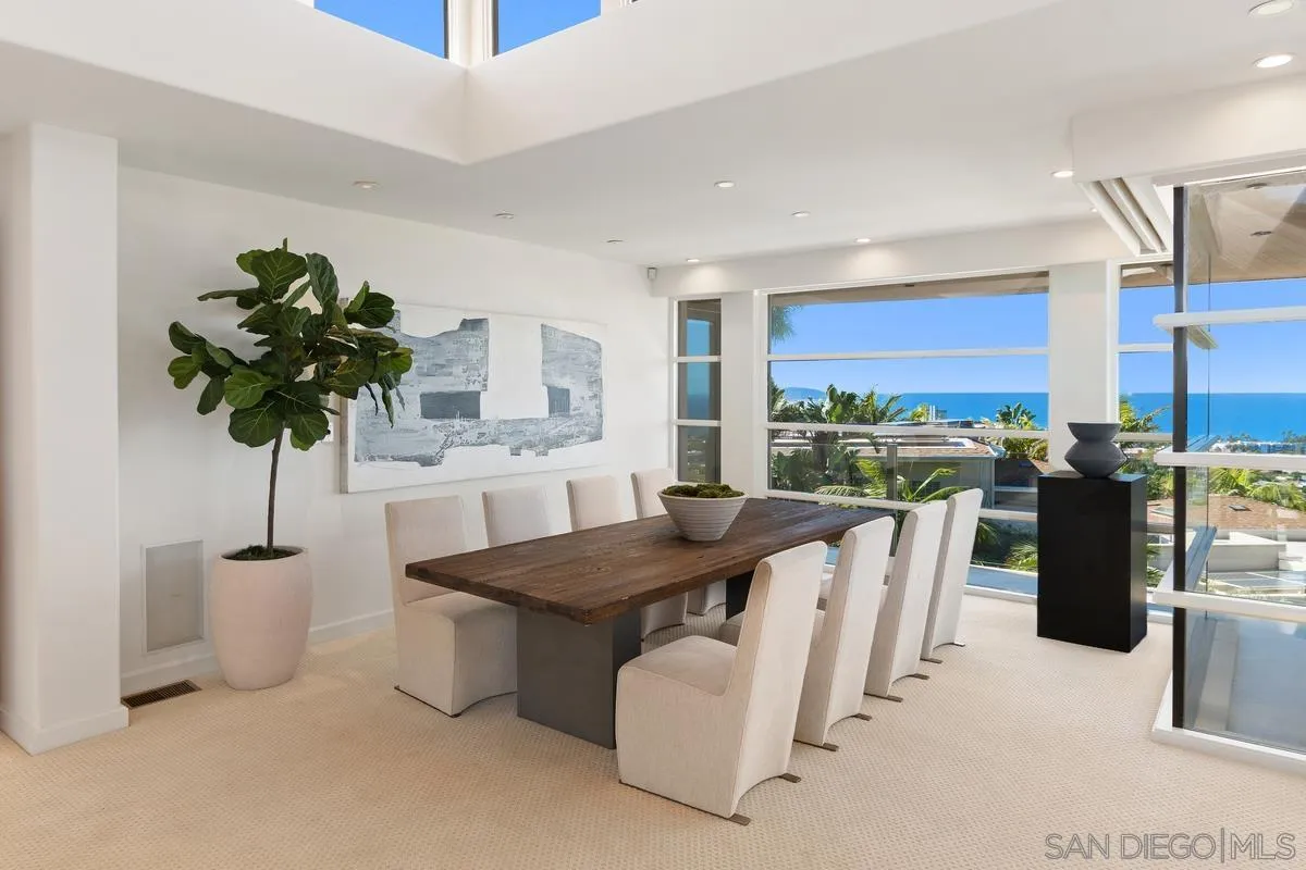 5486 Rutgers Road La Jolla, CA 92037 - Photo 10 of 47 a living room with furniture a chandelier and a dining table