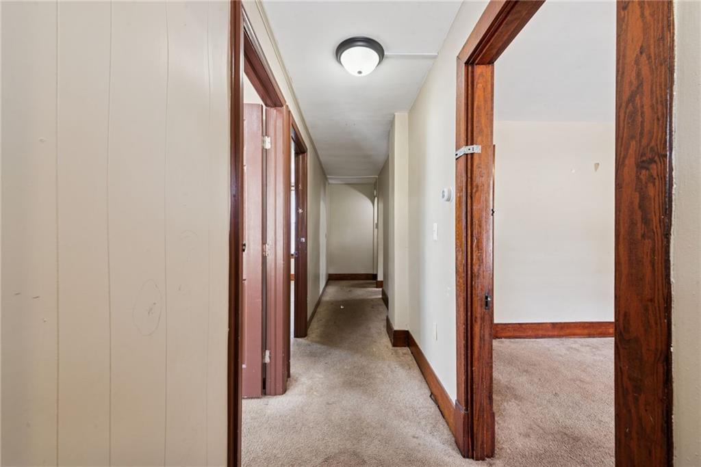 1442 Rostraver Street Monessen, PA 15062 - Photo 13 of 29 a view of a hallway with wooden shelves