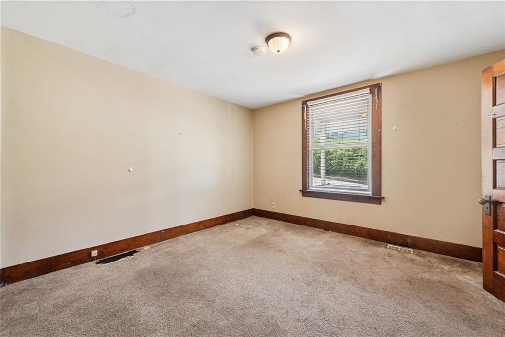 1442 Rostraver Street Monessen, PA 15062 - Photo 14 of 29 an empty room with windows