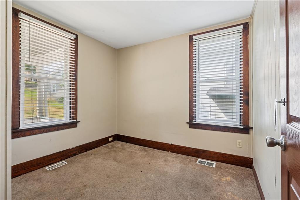 1442 Rostraver Street Monessen, PA 15062 - Photo 16 of 29 a view of an empty room with a window