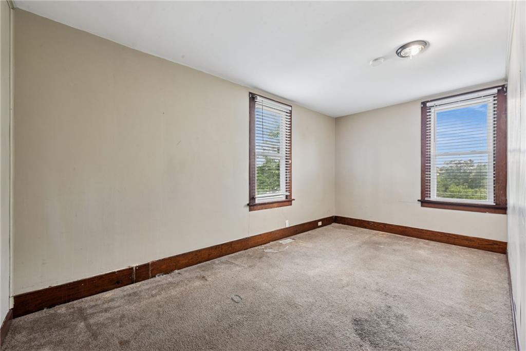 1442 Rostraver Street Monessen, PA 15062 - Photo 18 of 29 an empty room with windows