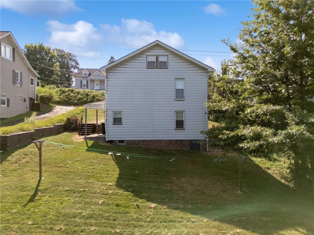 1442 Rostraver Street Monessen, PA 15062 - Photo 5 of 29 a house with river in front of it