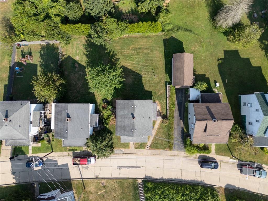 1442 Rostraver Street Monessen, PA 15062 - Photo 7 of 29 an aerial view of multiple houses with yard