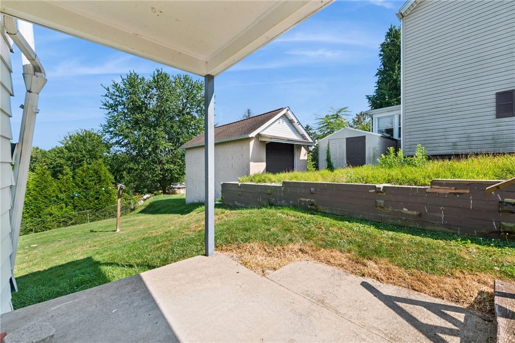 1442 Rostraver Street Monessen, PA 15062 - Photo 10 of 29 a front view of a house with a yard
