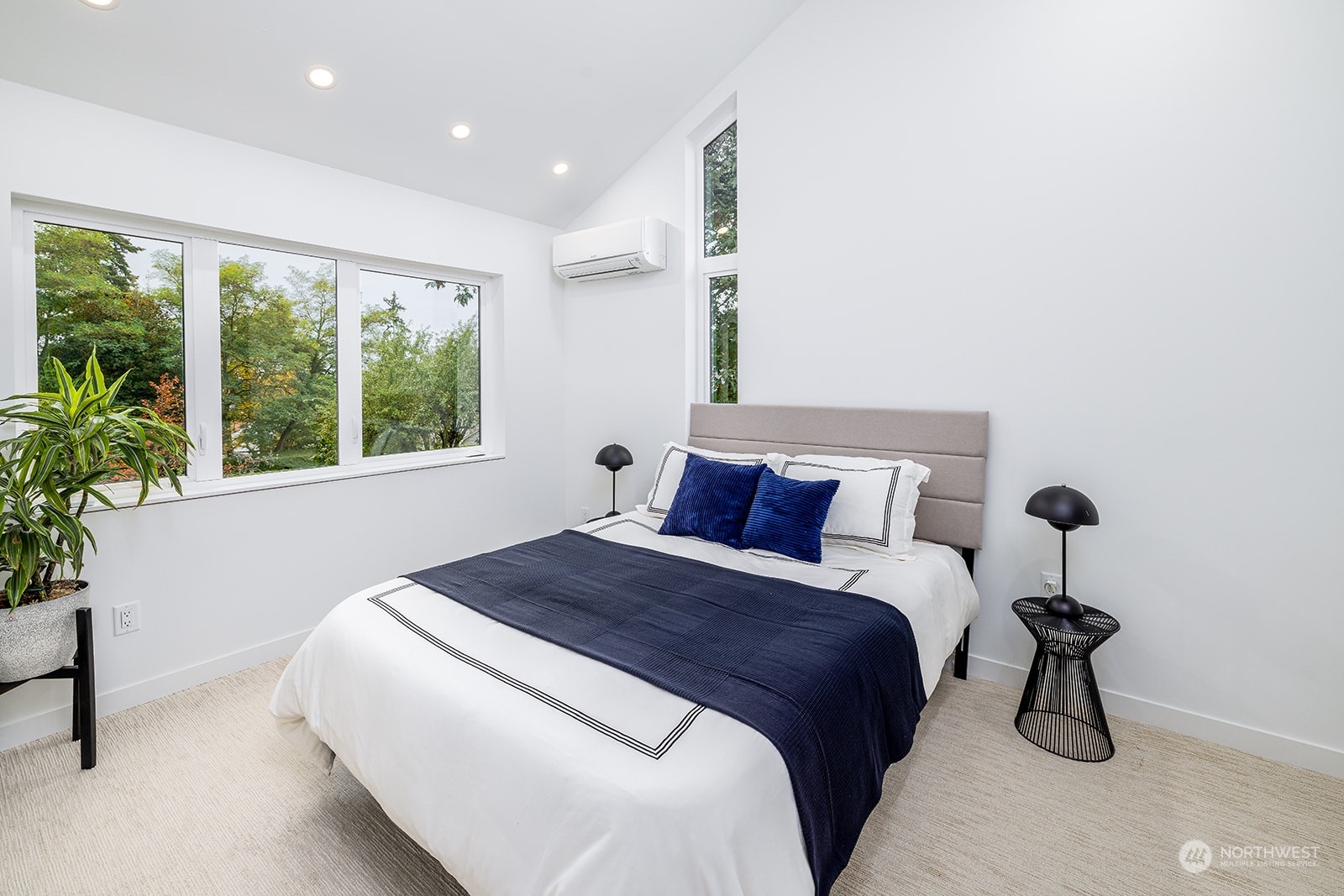 9019 8th Avenue Northeast Seattle, WA 98115 - Photo 11 of 14 a bedroom with a bed and a potted plant