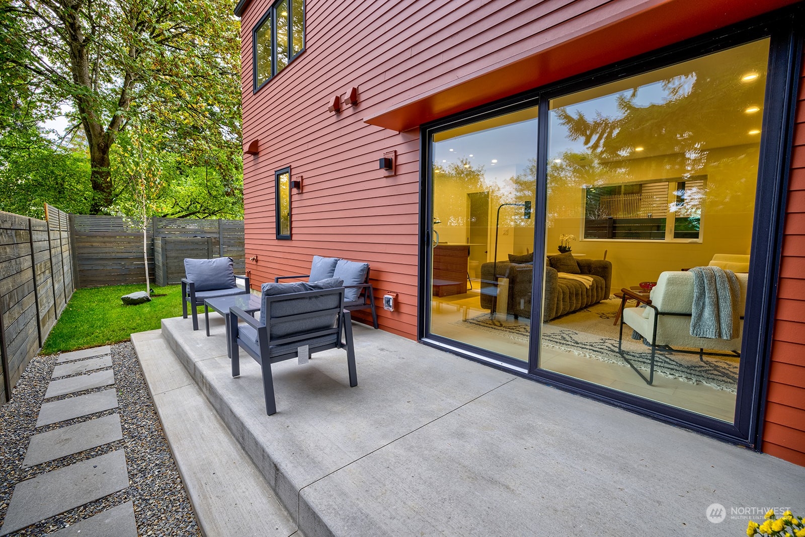 9019 8th Avenue Northeast Seattle, WA 98115 - Photo 14 of 14 a backyard view of a house with outdoor seating