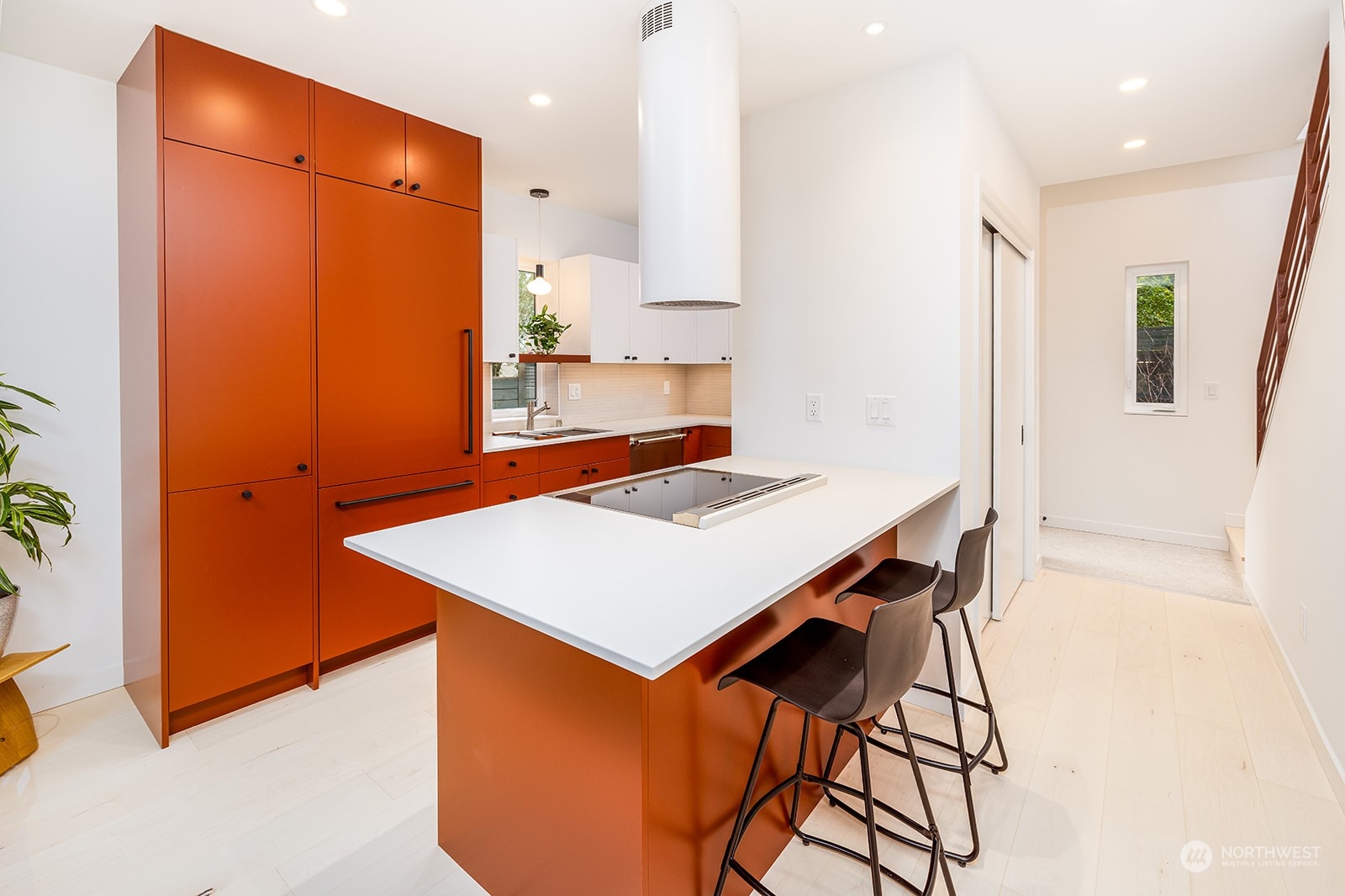9019 8th Avenue Northeast Seattle, WA 98115 - Photo 4 of 14 a kitchen with stainless steel appliances a table and chairs