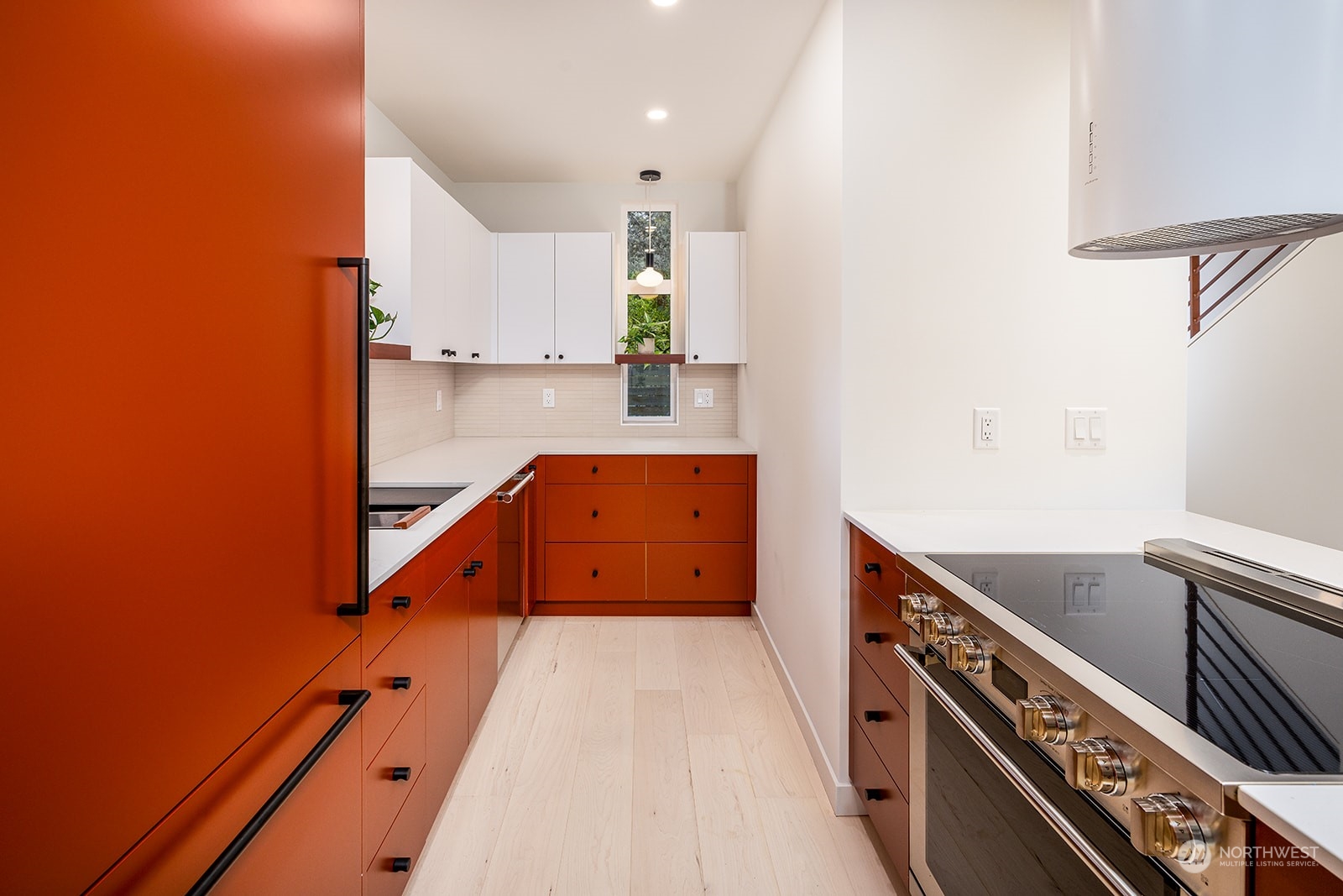 9019 8th Avenue Northeast Seattle, WA 98115 - Photo 5 of 14 a view of a kitchen with stove and cabinets