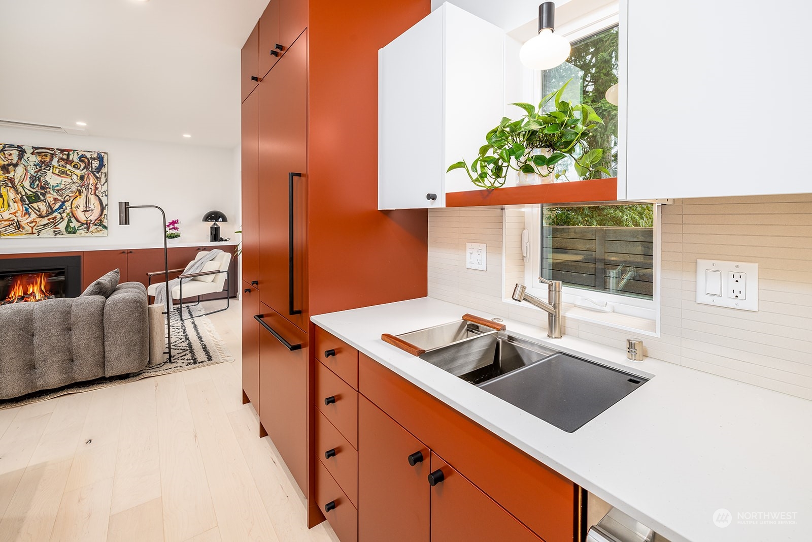 9019 8th Avenue Northeast Seattle, WA 98115 - Photo 6 of 14 a kitchen that has a sink and a stove