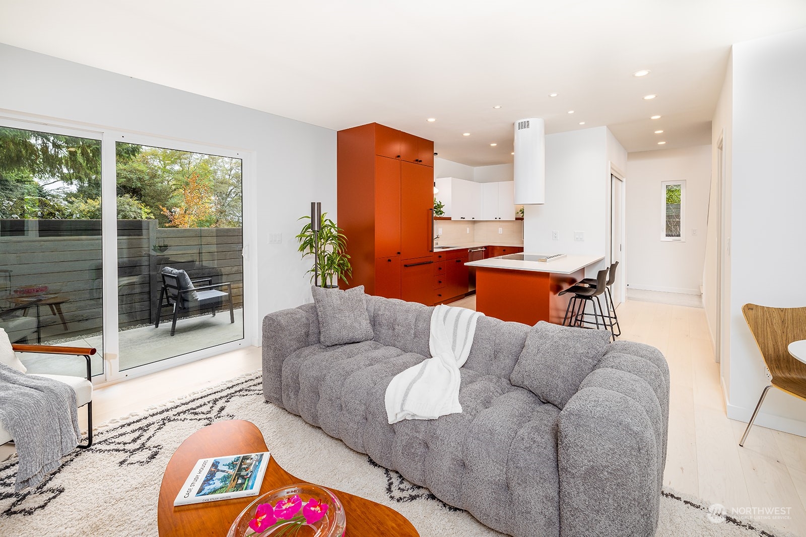 9019 8th Avenue Northeast Seattle, WA 98115 - Photo 7 of 14 a living room with furniture and a floor to ceiling window
