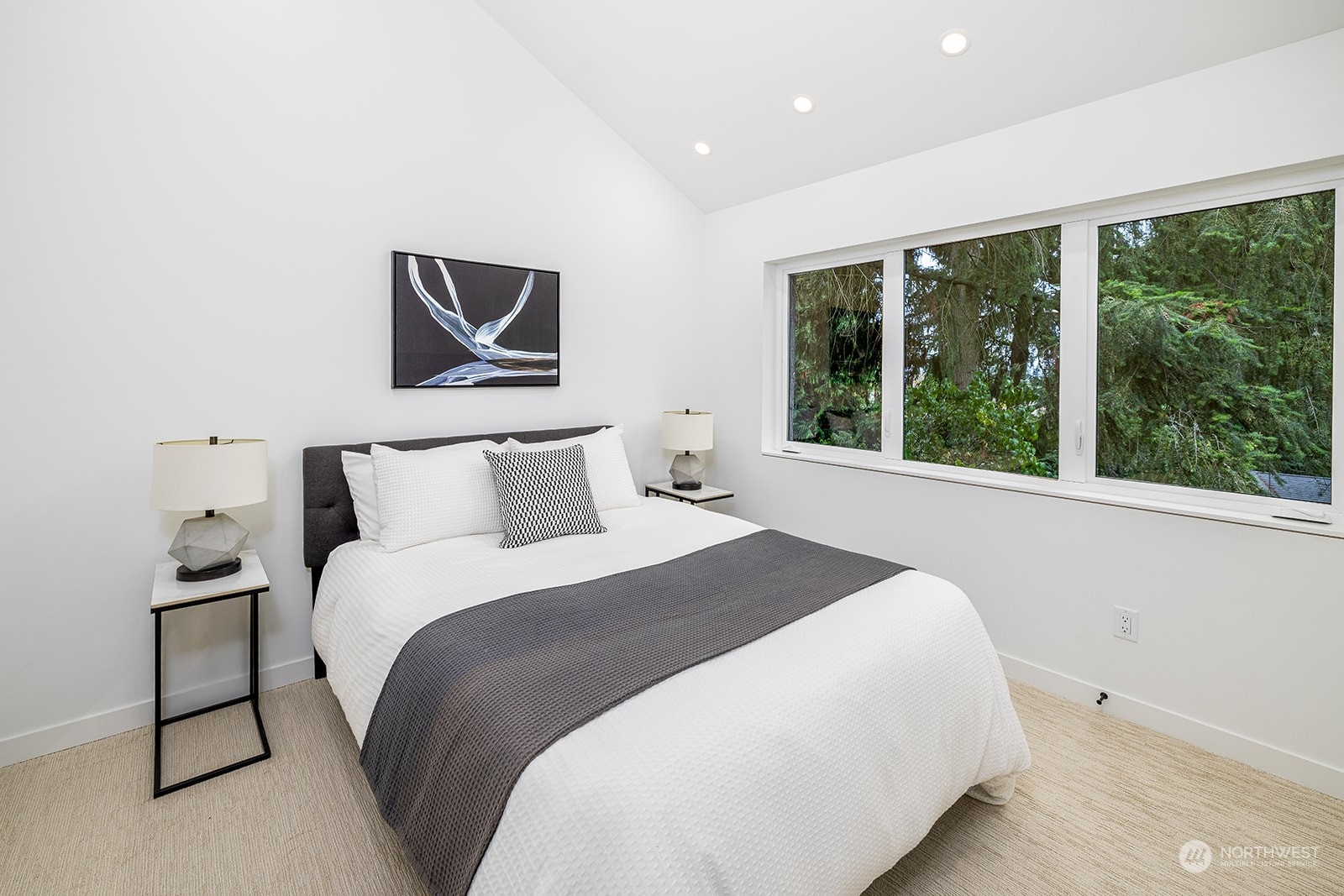 9019 8th Avenue Northeast Seattle, WA 98115 - Photo 10 of 14 a bedroom with a large bed and a large window