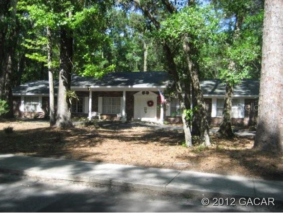 5603 Northwest 57th Way Gainesville, FL 32653 - Photo 1 of 1 a front view of a house with a yard