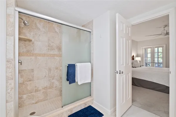 a bathroom with a shower and a sink