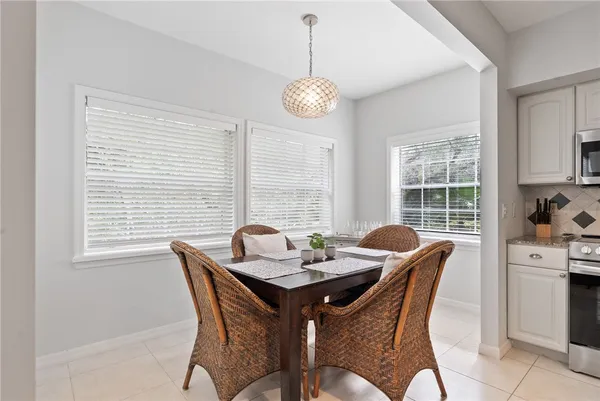 a view of a dining room with furniture wooden floor and a window