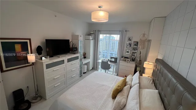 a bedroom with a bed and furniture