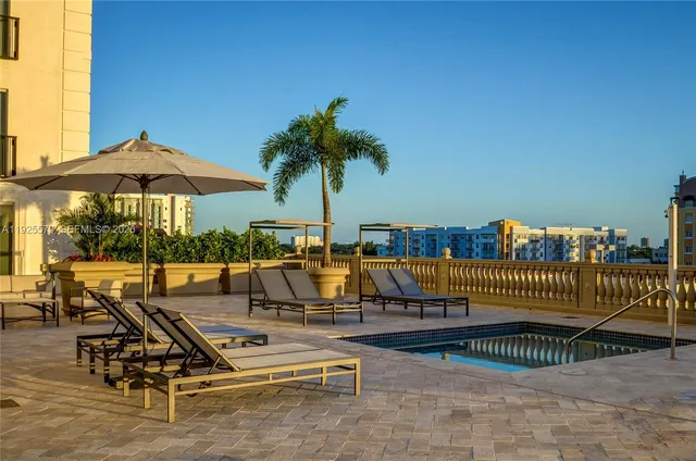 a view of swimming pool with outdoor seating