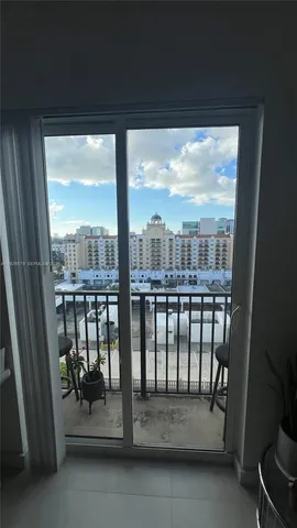 a view of a porch with a floor to ceiling window