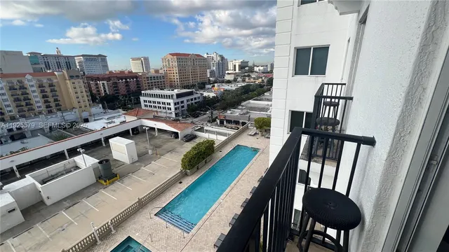 a view of a balcony with chairs
