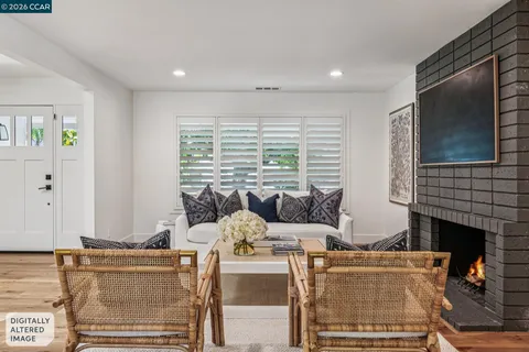 a dining room with furniture a chandelier and wooden floor