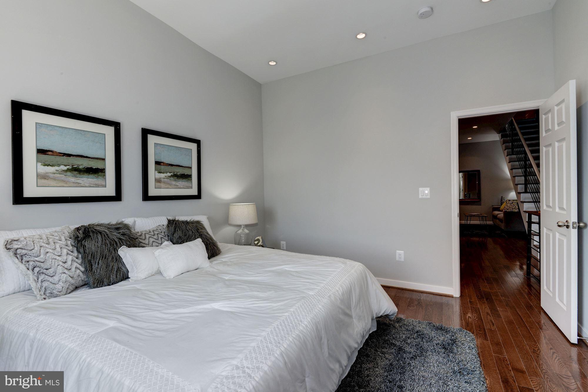 1616 6th Street Northwest, Unit 2 Washington, DC 20001 - Photo 13 of 20 a bedroom with bed and walk in closet
