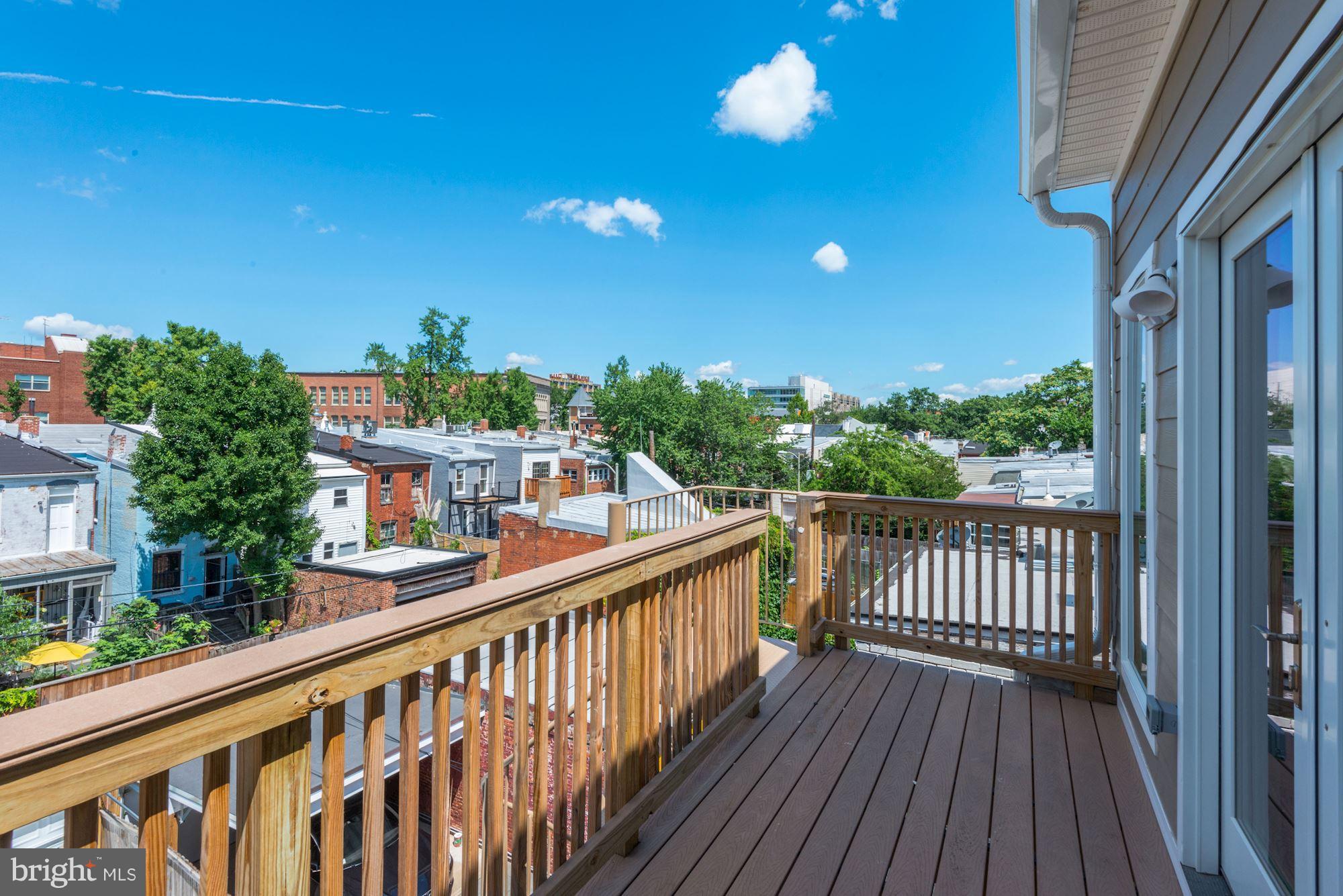 1616 6th Street Northwest, Unit 2 Washington, DC 20001 - Photo 17 of 20 a view of a balcony with wooden floor