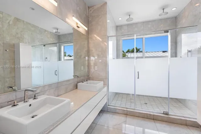 a spacious bathroom with a bathtub shower sink and mirror