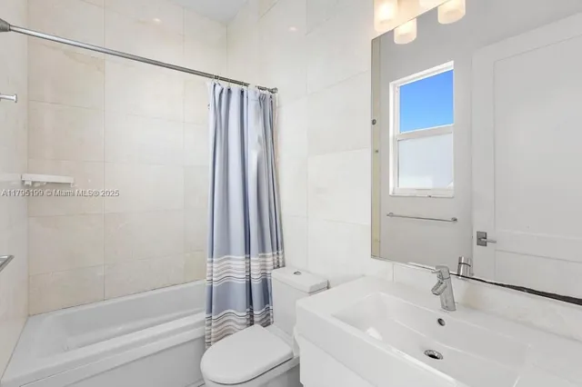 a bathroom with a sink and toilet