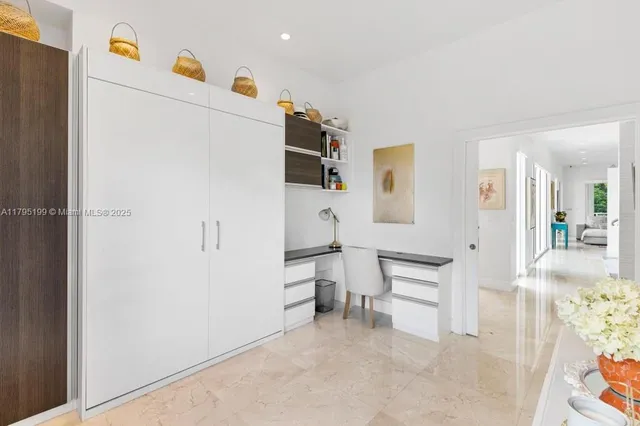 a white refrigerator freezer and a stove sitting inside of a kitchen