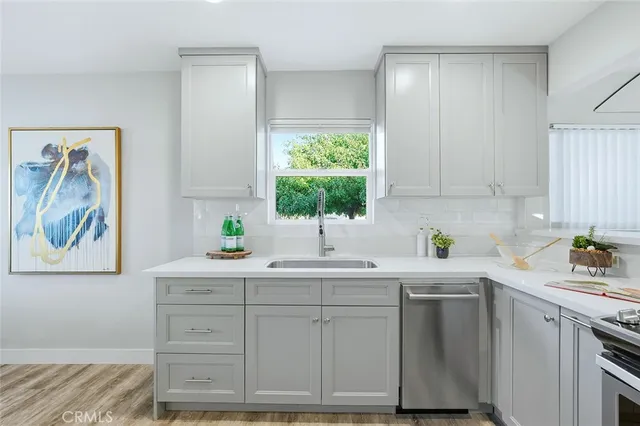 a kitchen with a sink and cabinets