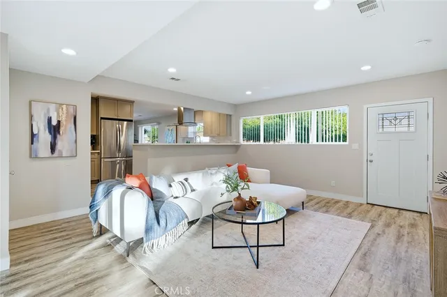 a living room with furniture and window