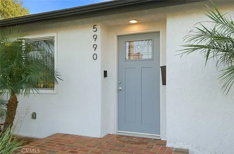 a view of bedroom and front door