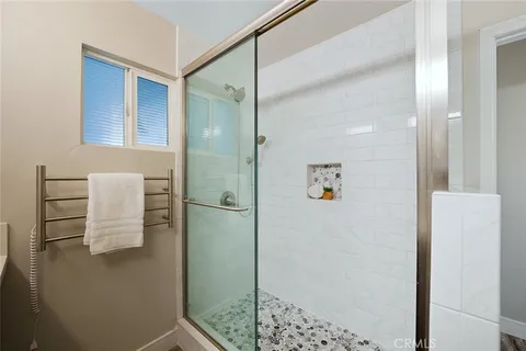 a bathroom with a shower and a sink