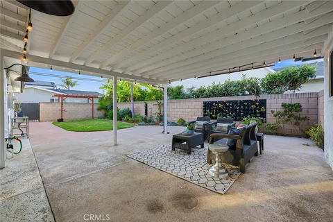 a view of a patio with a table and chairs