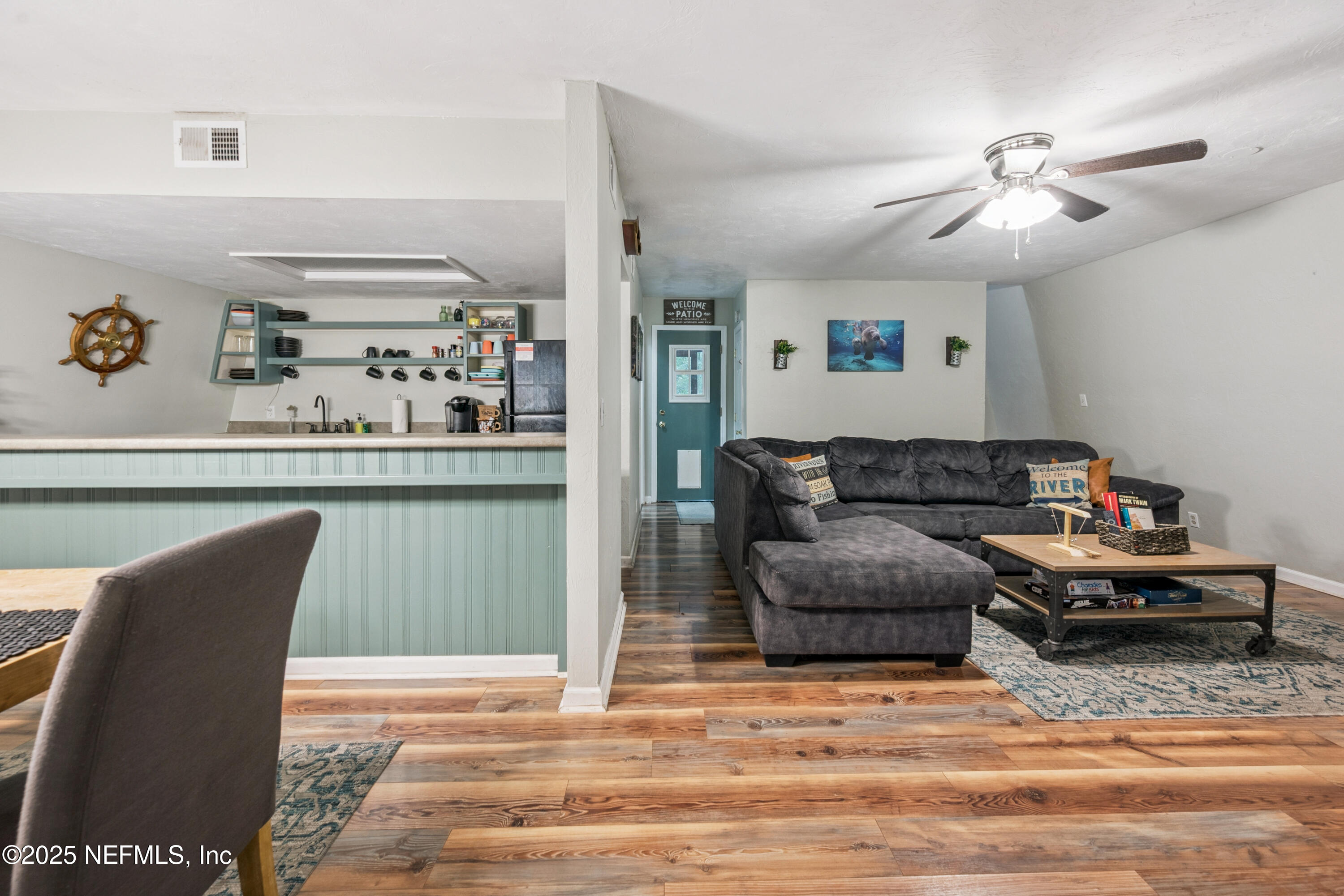141 Southwest Longhorn Terrace Fort White, FL 32038 - Photo 13 of 31 a living room with furniture and a chandelier